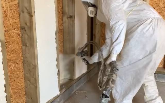 Spray foam expanding to fill a framed stud bay